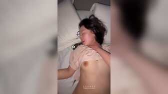 A tattooed young woman, clearly experienced, remains completely unfazed—replying to messages while being vigorously fucked